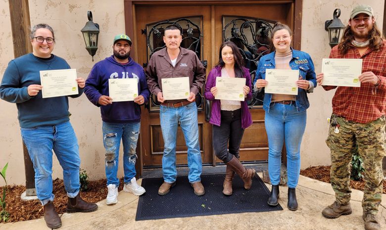 Troon team members with their diplomas after completing the Equitable Food Initiative training.##Photo PROVIDED