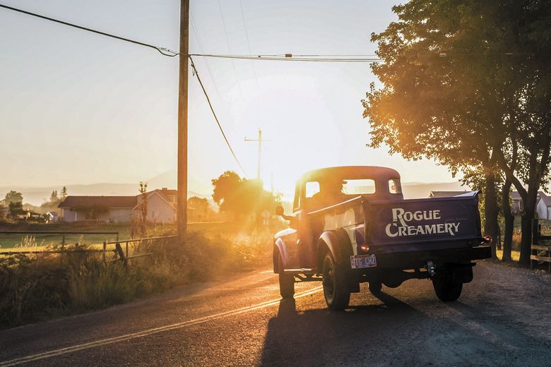 Bertha, the Rogue Creamery’s blue, 1948 Dodge pickup, driving into the sunset.##Photo CREDIT: Favoreat Bertha, the Rogue Creamery’s blue, 1948 Dodge pickup, driving into the sunset.##Photo CREDIT: Favoreat