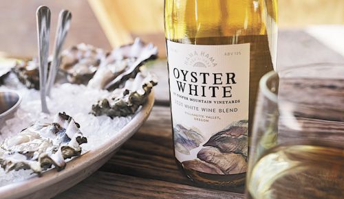 Fresh Hamma Hamma oysters on ice with Cooper Mountain Vineyard’s Oyster White. It’s a white wine blend created specifically to be enjoyed together.##Photo provided by Cooper Mountain Vineyards