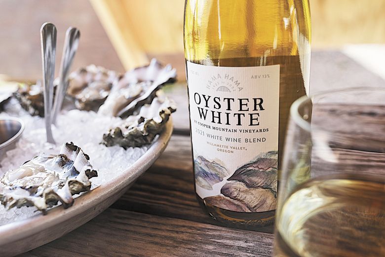 Fresh Hamma Hamma oysters on ice with Cooper Mountain Vineyard’s Oyster White. It’s a white wine blend created specifically to be enjoyed together.##Photo provided by Cooper Mountain Vineyards