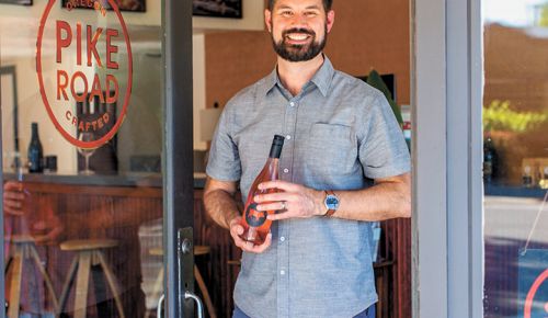 Pike Road Wines’ Retail Sales Director Dane Campbell welcoming guests to the new tasting room.##PHOTO BY ANNA CAMPBELL