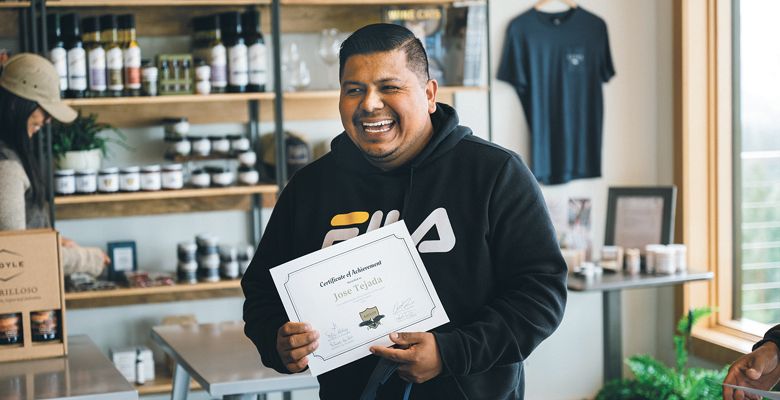 José Tejada smiles after receiving his AHIVOY program certificate of completion. ##Photo by Sean Carr