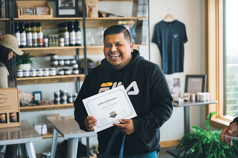 José Tejada smiles after receiving his AHIVOY program certificate of completion. ##Photo by Sean Carr