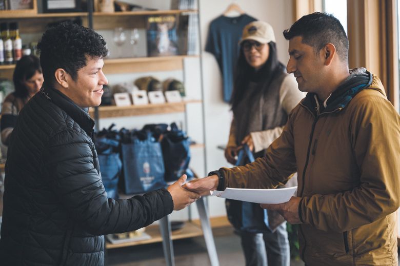 Jorge Cerpas shaking hands with AHIVOY Co-Founder, Miguel Lopez. 
##Photo by Sean Carr