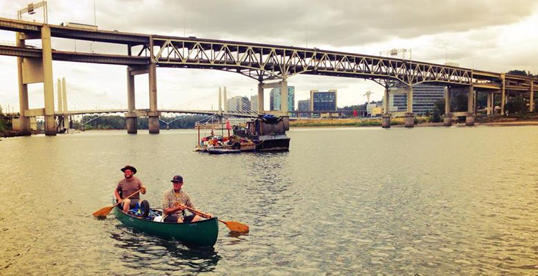 Brad Ford and Ryan Kelley deliver cases of Project 1899 via a canoe to distributor Casa Bruno in Portland.##Photo provided