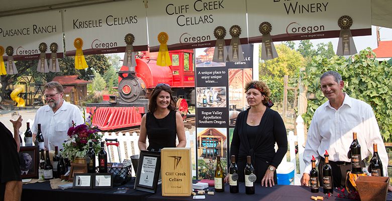 Winery representatives await attendees at the opening of the 2015 Oregon Wine Experience.##Photo provided