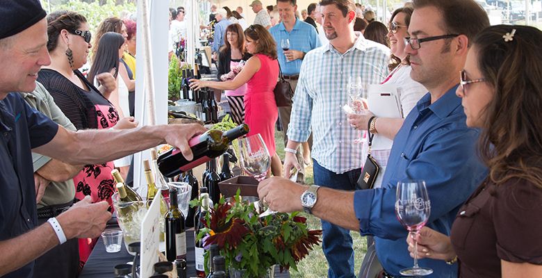 Guests sample the many different wines offered during the festival.##Photo provided