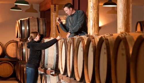 Greg and Kara Paneitz taste wine in the barrel at Wooldridge Creek Winery.##Photo provided