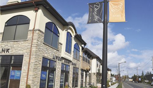 Dundee business and city officials are cooperating to improve the look of Dundee’s downtown area, including banners, such as these in front of Red Hills Inn, that invite people to “Stay.”