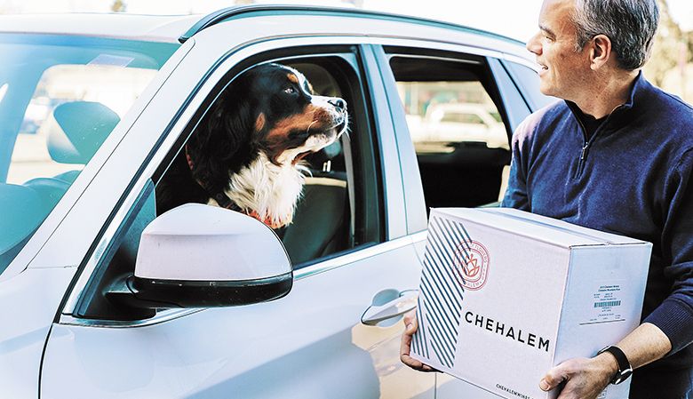 Scott Jeffrey at Chehalem Winery in Newberg delivers wine to an eager customer. ##Photo provided