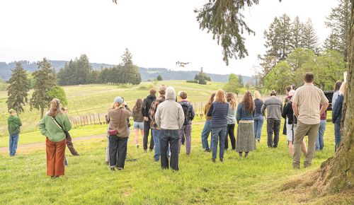 A drone spraying nettle tea on Soter Vineyards&rsquo; biodynamic vineyard as attendees watch at this year&rsquo;s Organically Grown Wine Conference. ## Photo by Shawn Linehan