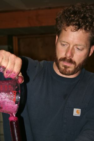 Brian McCormick gets wine ready to test in the lab at Memaloose.