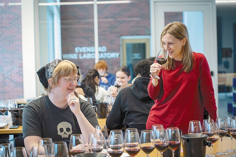 Toni Ketrenos sampling wines with a Linfield student. ## Photo provided by Linfield University