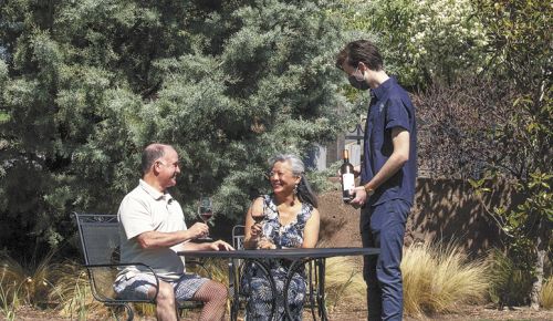A couple enjoys the sunny weather at 2Hawk Vineyard and Winery in Medford. ##Photo courtesy of 2Hawk Vineyard