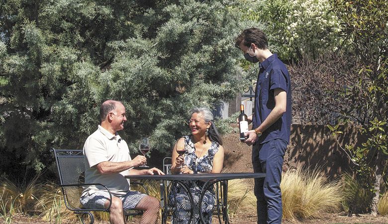 A couple enjoys the sunny weather at 2Hawk Vineyard and Winery in Medford. ##Photo courtesy of 2Hawk Vineyard