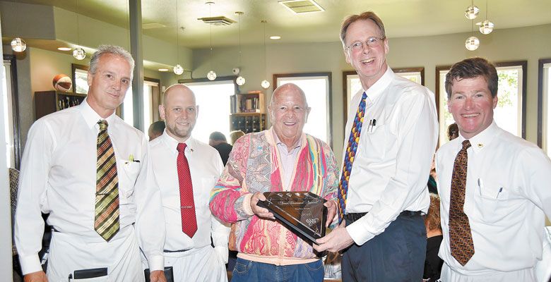 The Bay House in Lincoln City celebrates its AAA Four-Diamond Award with patron Gerry Frank (middle). Waitstaff Van McKnight (far left), Ross Rehberg and Pete Doerflinger (far right) join in the celebration with proprietor Steve Jones. ##Photo provided.