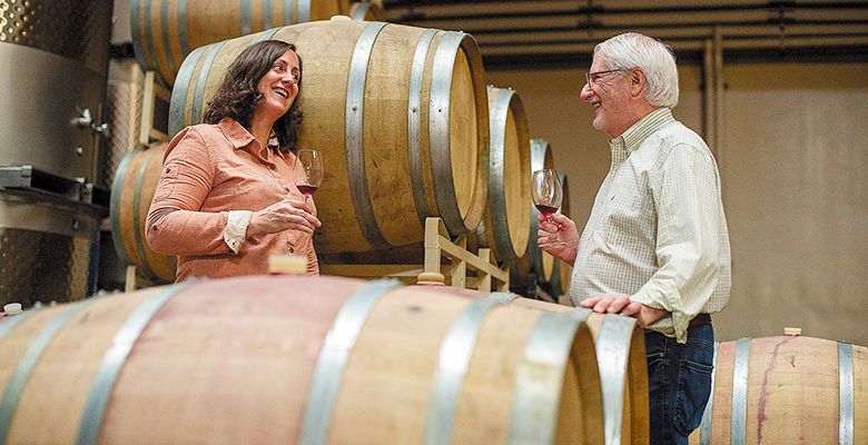 Gina Hennen, Adelsheim Vineyard s director of winemaking and viticulture, sampling wine in the cellar with founder David Adelsheim. ## Photo provided by Adelsheim Vineyard