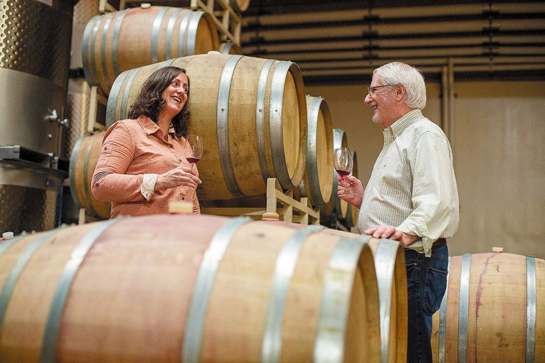Gina Hennen, Adelsheim Vineyard s director of winemaking and viticulture, sampling wine in the cellar with founder David Adelsheim. ## Photo provided by Adelsheim Vineyard