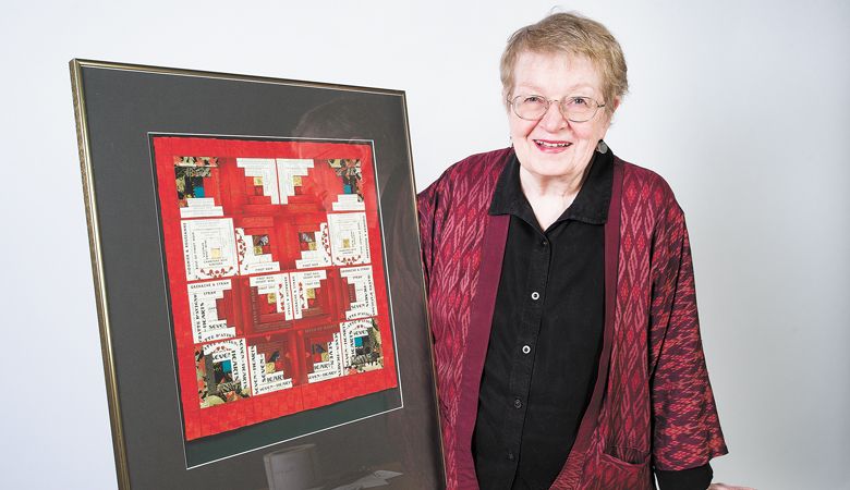 Artist Alice Leunen shows a piece she created using Seven of Hearts labels; the winery operates a tasting room in the heart of Carlton.
