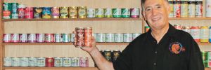 Allan Green and his international canned wine collection. ##Photo provided