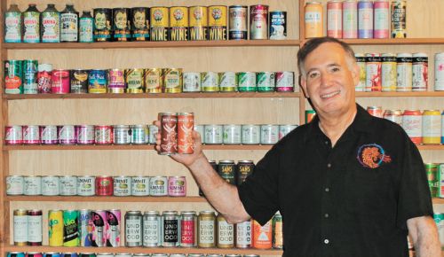 Allan Green and his international canned wine collection. ##Photo provided