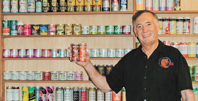 Allan Green and his international canned wine collection. ##Photo provided