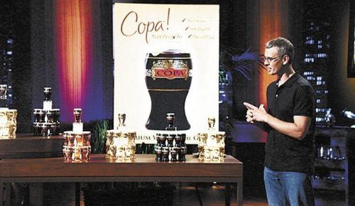 James Martin presents his business venture, Copa Di Vino, to judges on the ABC TV show “Shark Tank.”