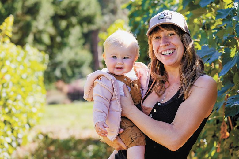 Amy Jay, vineyard manager, regenerative farmer/consultant and aspiring winemaker with baby Avery.##Photo by Molly Bermea