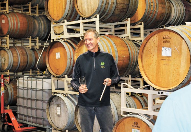 Andreas Wetzel, owner of Wetzel Estate, sharing wine samples in his barrel room. ##Photo provided by Wetzel Estate