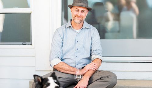 Andrew Davis, the Oregon Wine Press 2025 Person of the Year, with Mulligan, his assistant s border collie. ## Photo by Lester Tsai