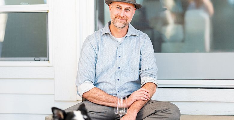 Andrew Davis, the Oregon Wine Press 2025 Person of the Year, with Mulligan, his assistant s border collie. ## Photo by Lester Tsai
