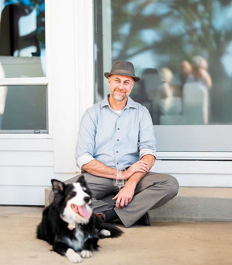 Andrew Davis, the Oregon Wine Press 2025 Person of the Year, with Mulligan, his assistant s border collie. ## Photo by Lester Tsai