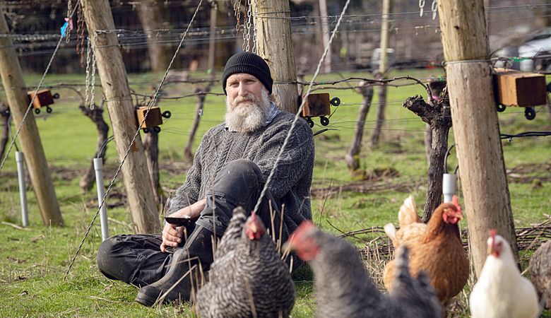 Antiquum Farm owner Stephen Hagen with some of the critter farm crew.##Photo by Kathryn Elsesser