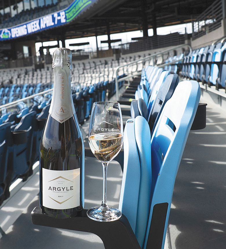 A bottle and glass of Argyle Winery sparkling wine at a Hillsboro Hops baseball game.  ## Photo provided by Argyle Winery