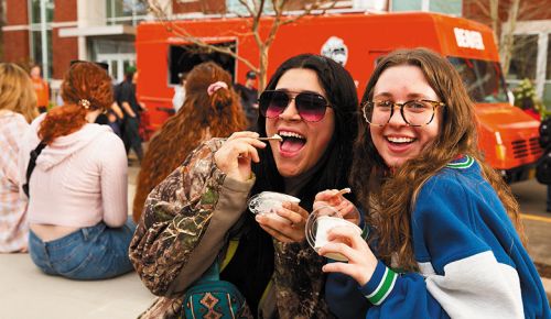 Two OSU students enjoying scoops of ice cream on the Corvallis creamery s opening day. ## Photo provided by OSU College of Agricultural Sciences