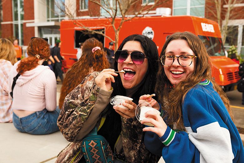 Two OSU students enjoying scoops of ice cream on the Corvallis creamery s opening day. ## Photo provided by OSU College of Agricultural Sciences