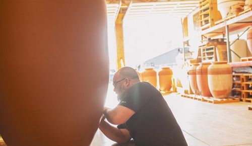 Potter Andrew Beckham creating a NOVUM clay amphora. ## Photo by Carolyn Wells-Kramer