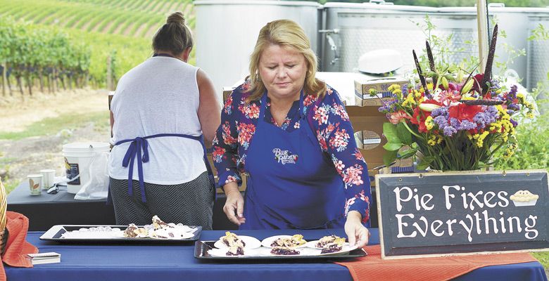 Jamie DeRaeve Lewis serves Blue Raeven pie. ##Photo by Elizabeth Gibson