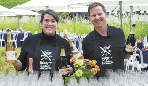 Casee Clark of R. Stuart and Jonathan Lampe of A to Z Wineworks and REX HILL pour wines during BIG NIGHT at Sokol Blosser Winery. ##Photo by Elizabeth Gibson