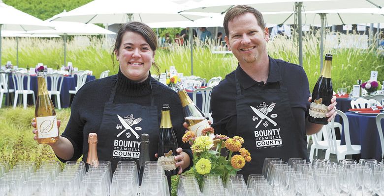 Casee Clark of R. Stuart and Jonathan Lampe of A to Z Wineworks and REX HILL pour wines during BIG NIGHT at Sokol Blosser Winery. ##Photo by Elizabeth Gibson