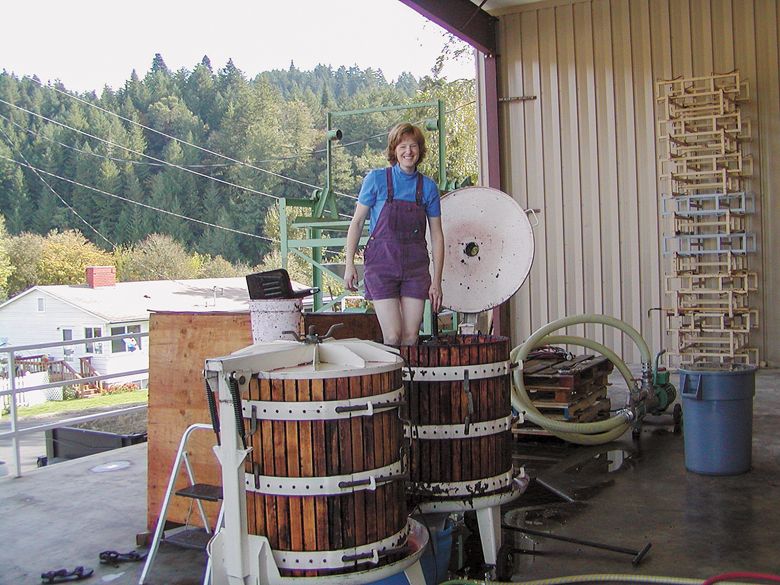Sue Brandborg, co-founder of Brandborg Vineyard and Winery still smiling after processing 65 tons of fruit in their two basket presses. This photo was taken in 2004.##Photo provided by Brandborg Vineyards and Winery
