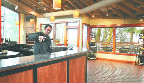 Eddie Zavestoski, a Sokol Blosser tasting room associate, works in the renovated space.  Photo provided.