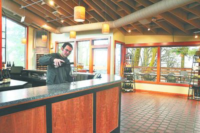 Eddie Zavestoski, a Sokol Blosser tasting room associate, works in the renovated space.  Photo provided.