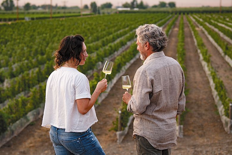 Brooke Delmas Robertson standing in family-owned SJR Vineyard with father Steve Robertson. ## Photo provided by Delmas Brooke Delmas Robertson standing in family-owned SJR Vineyard with father Steve Robertson. ## Photo provided by Delmas