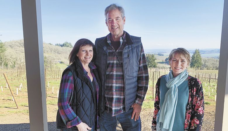 Jon and Kathy Lauer (left), owners of Bryn Mawr Vineyards, outside the tasting room with hospitality manager Karyn Howard Smith. ##Photo by Patty Mamula