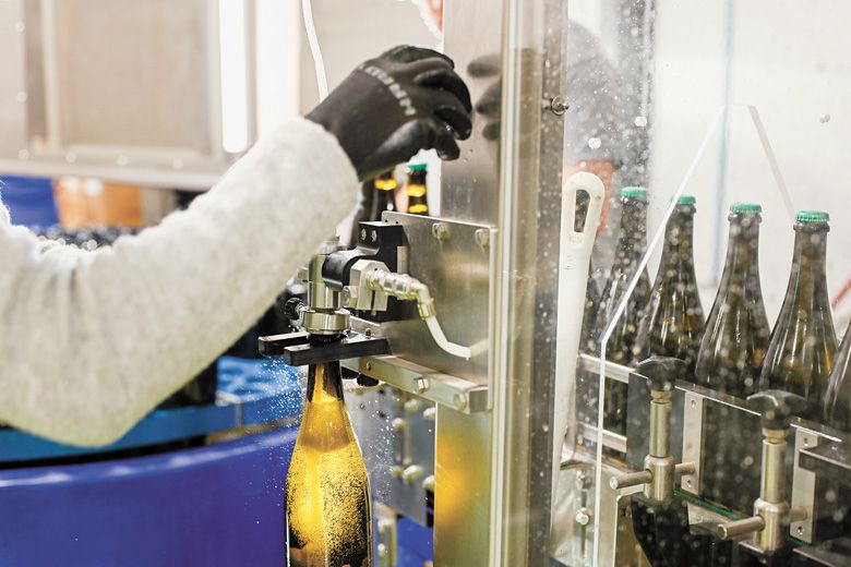 After dosage is added, the bottles are then topped up with undosed base wine to return them to proper 750ml levels. After dosage is added, the bottles are then topped up with undosed base wine to return them to proper 750ml levels.