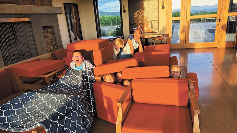 The Cho children and their friends making a furniture fort on the 4th of July.  ## Photo provided by CHO Wines