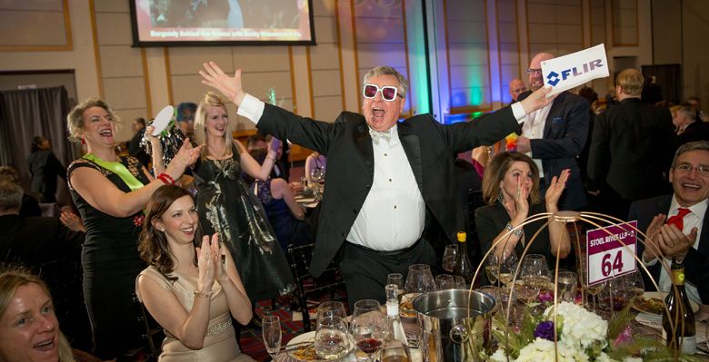 Chris Hermann of 00 Wines 
excitedly wins an auction lot at the 2019 Classic Wines Auction at the Oregon Convention Center in Portland. ##Photo by John Valls