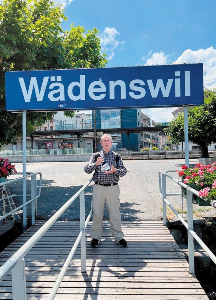 Dan Chapel, owner of Cardwell Hill Cellars, holding a bottle of his wine while standing under a sign in Wädenswil, Switzerland. ## Photo provided by Cardwell Hill Cellars Dan Chapel, owner of Cardwell Hill Cellars, holding a bottle of his wine while standing under a sign in Wädenswil, Switzerland. ## Photo provided by Cardwell Hill Cellars