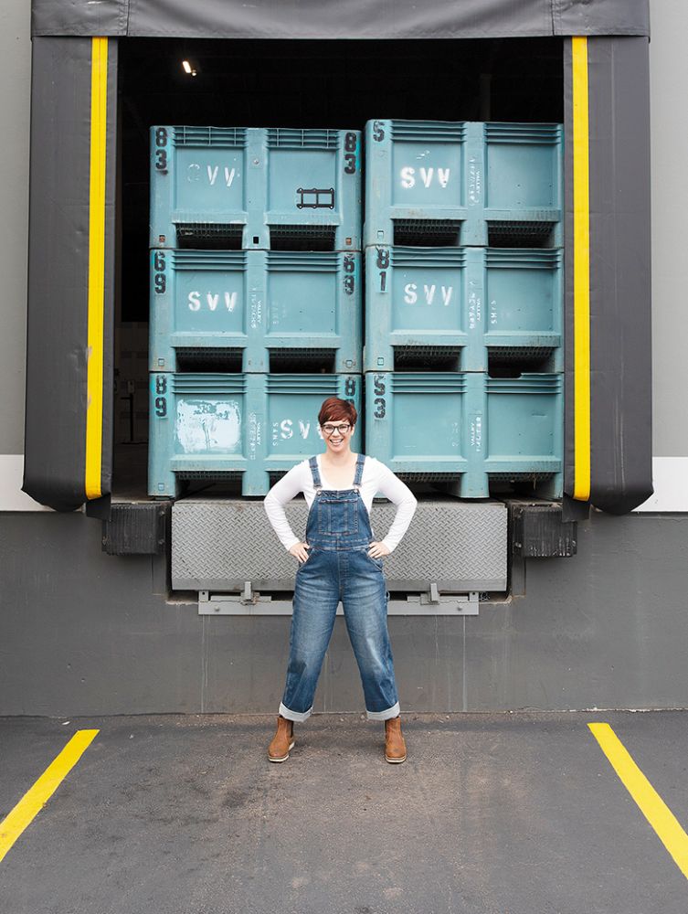 Carrie Wynkoop, founder of AVP Wine Collective, standing in front of grape bins stacked on a loading dock. ## Photo provided by AVP Wine Collective Carrie Wynkoop, founder of AVP Wine Collective, standing in front of grape bins stacked on a loading dock. ## Photo provided by AVP Wine Collective
